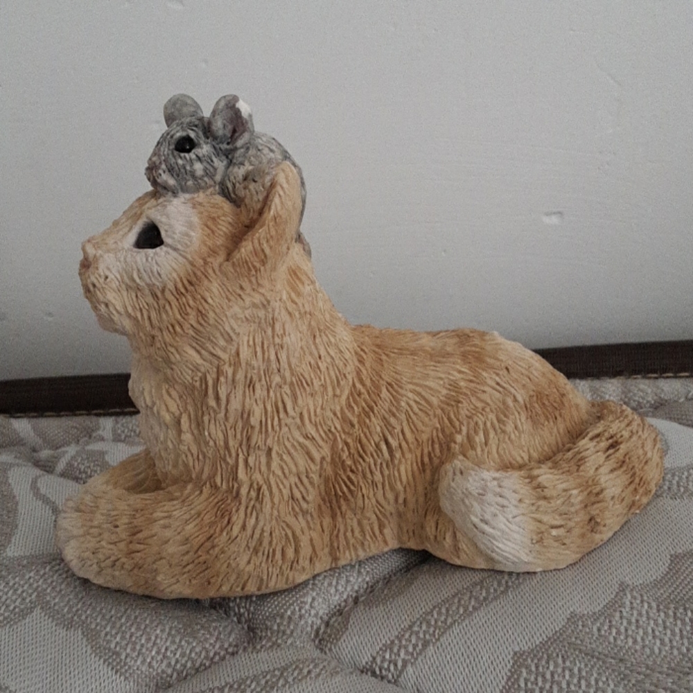 Cat with mouse on head